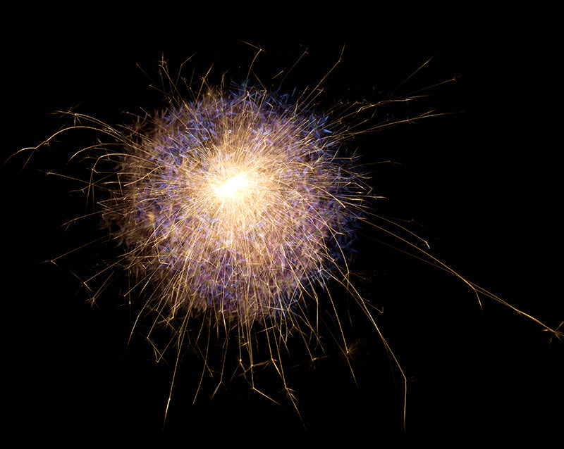 Underwater photograph exploding flower series sparks energy shot Warm Low Light tonality from the Fusion series