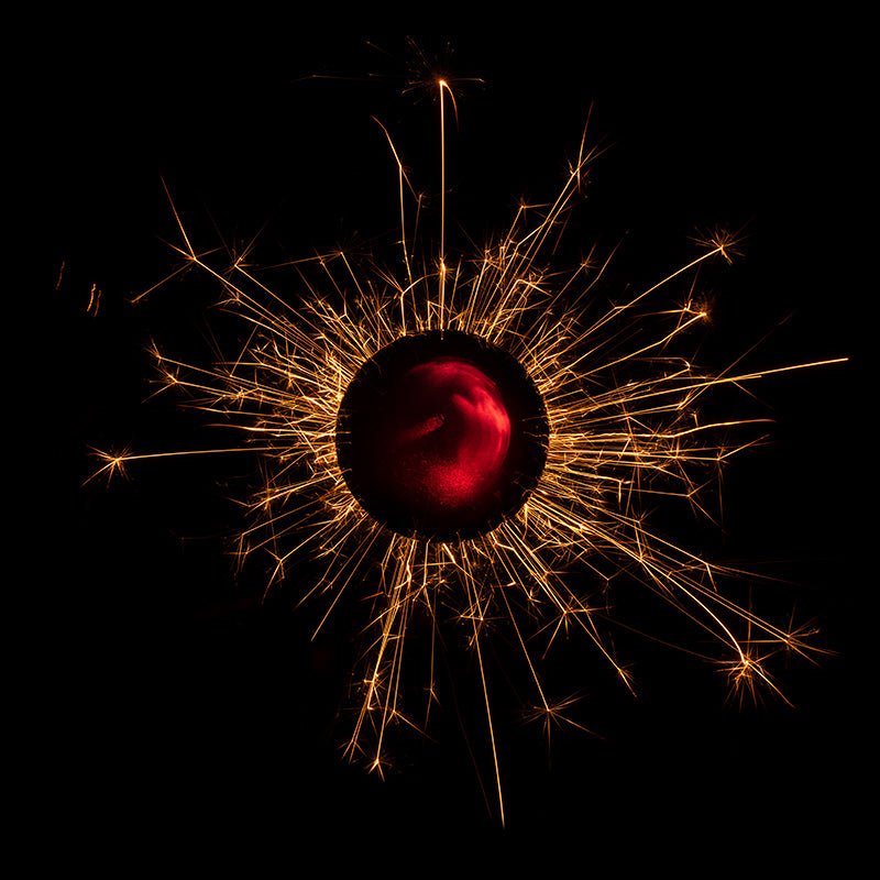 Underwater photograph exploding flower series sparks energy shot Warm Low Light tonality from the Fusion series