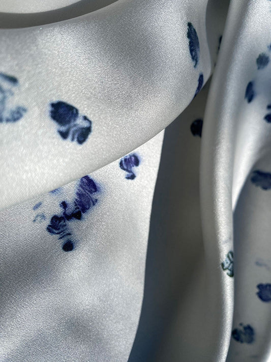 Bright blue polka dot silk scarf with hand-rolled edge