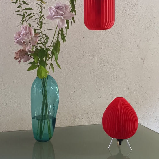 Red Vortex table lamp 3D printed from recycled plastic