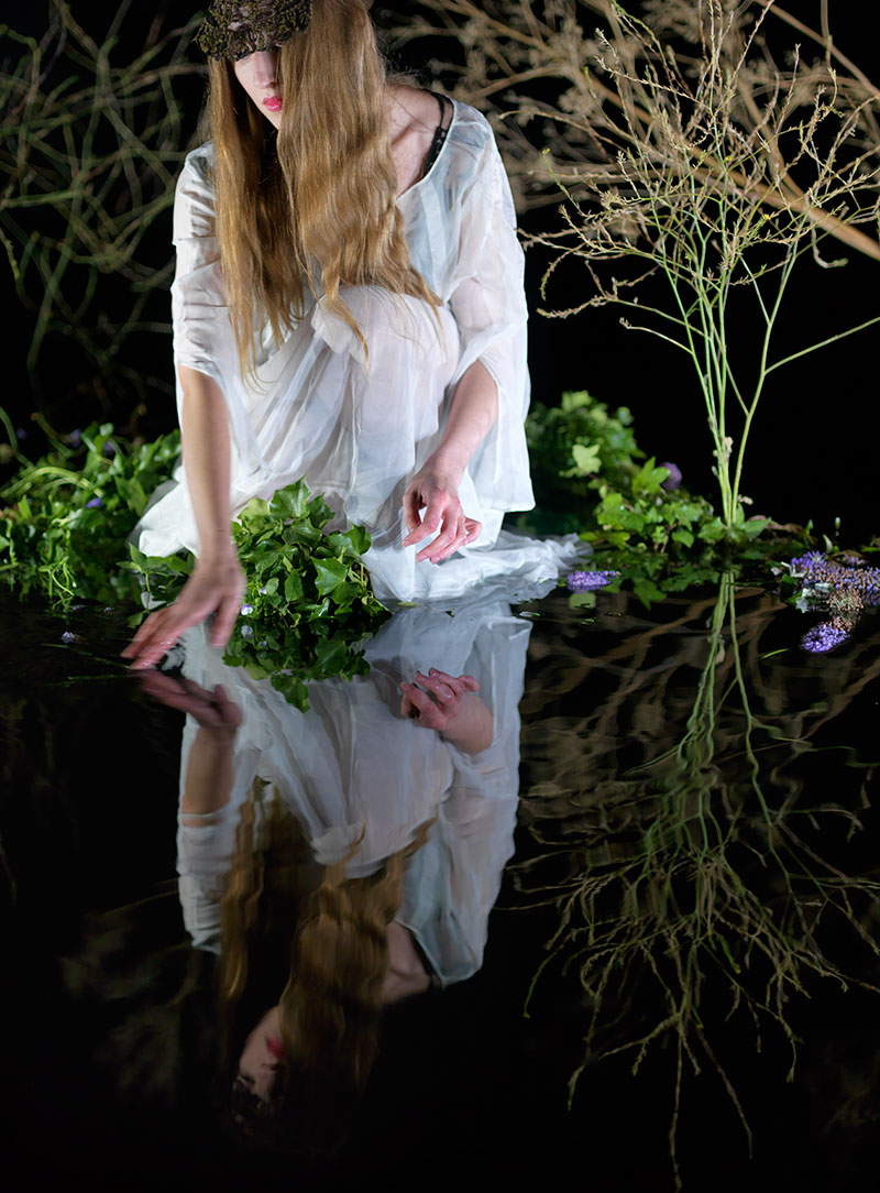 hand creating a complex underwater reflection pool in the studio for a theatrical set build